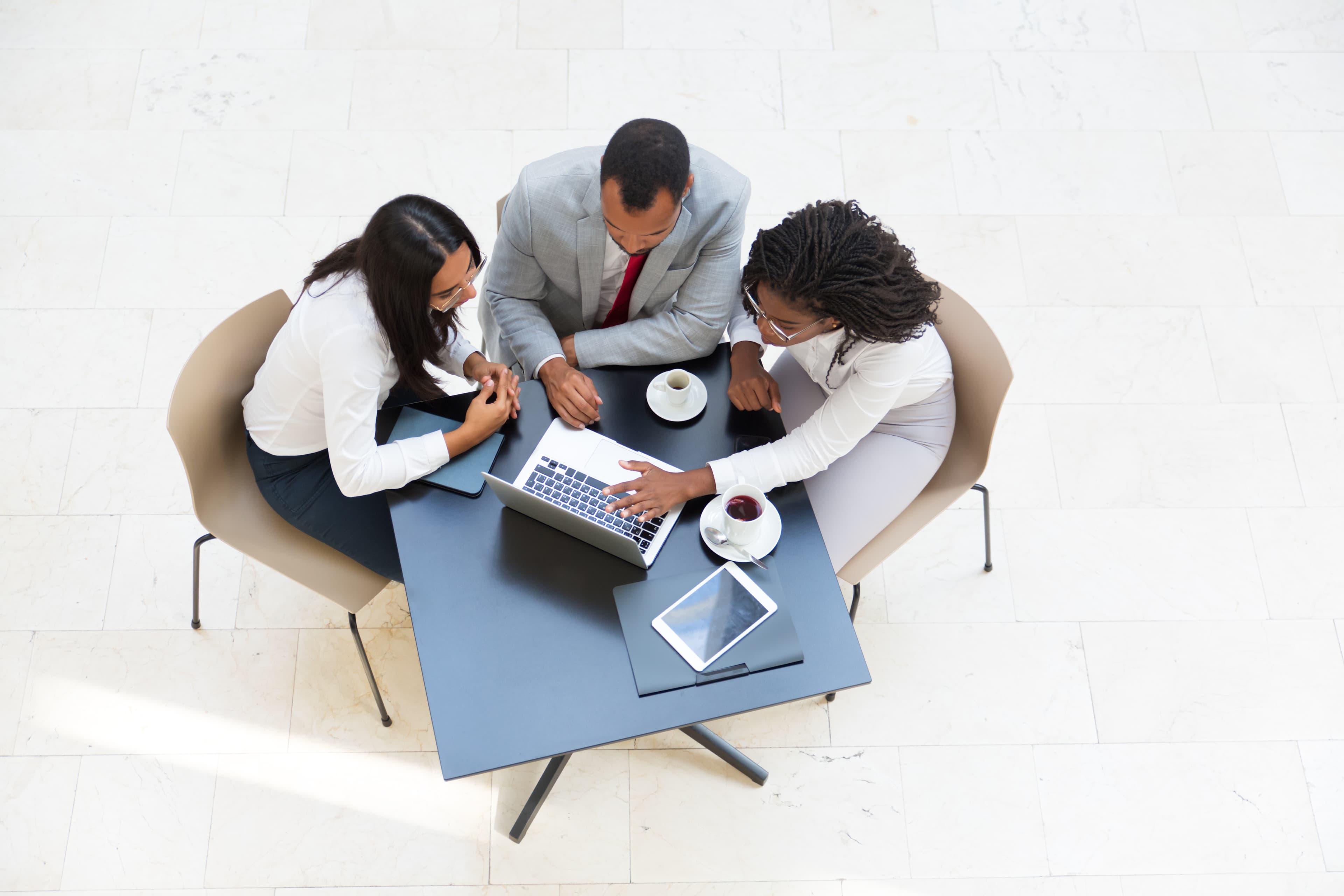 Team collaborating around a table in a bright office